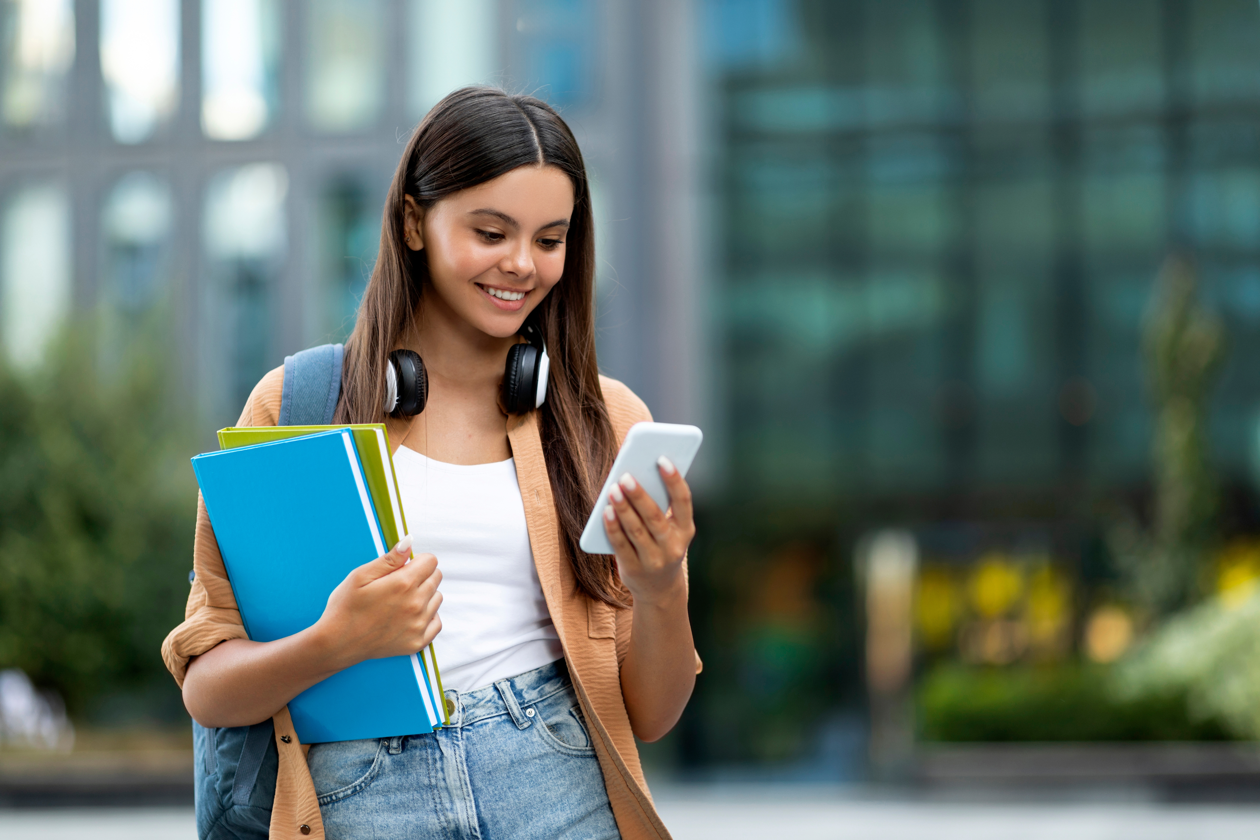 Student smiling with phone
